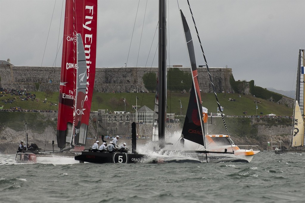 Emirates Team New Zealand rounds the first mark behind Oracle Coutts in the final fleet race of the America's Cup World Series in Plymouth. 18/9/2011 photo copyright Chris Cameron/ETNZ http://www.chriscameron.co.nz taken at  and featuring the  class