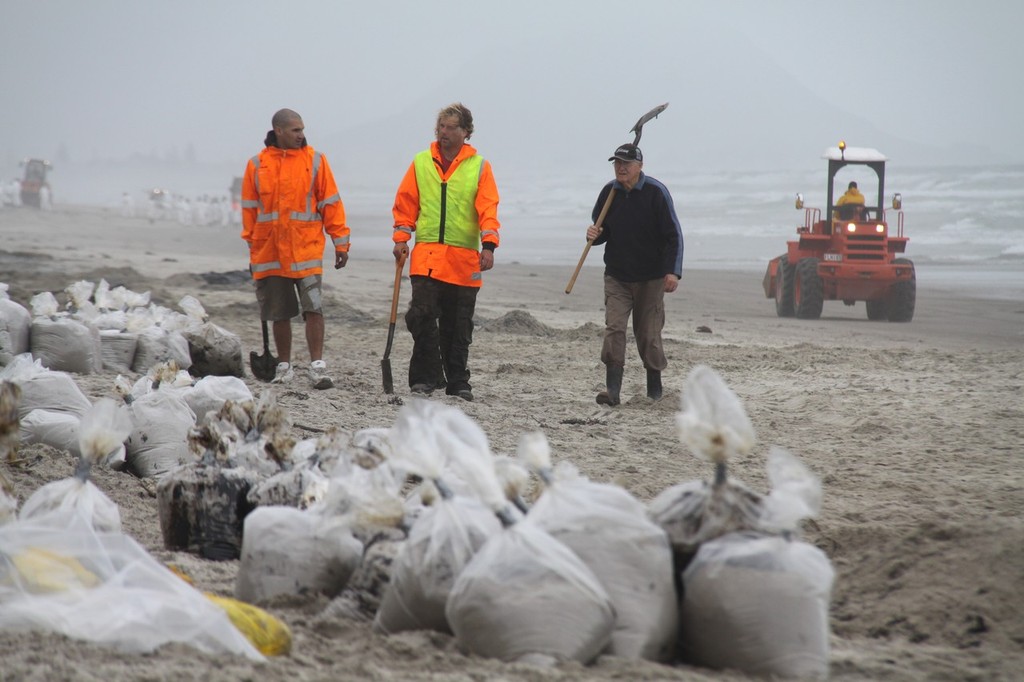 Clean-up crews hard at work cleaning the shores on Papamoa Beach - Rena Disaster - 13 October 2011 photo copyright Maritime NZ www.maritimenz.govt.nz taken at  and featuring the  class