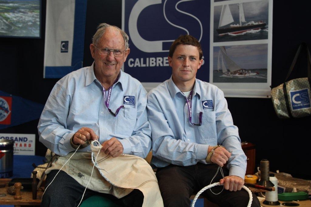 Veteran sailmaker Frank Warnock, left, and Tom Barker demonstrating classic sailmaking techniques on the Calibre Sails stand. © SW
