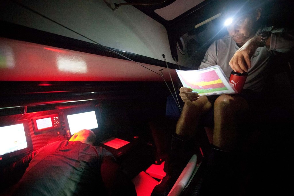 Ken Read doing some homework in the Nav Station. PUMA Ocean Racing powered by BERG during leg 1 of the Volvo Ocean Race 2011-12, from Alicante, Spain to Cape Town, South Africa. (Credit: Amory Ross/PUMA Ocean Racing/Volvo Ocean Race) photo copyright Amory Ross/Puma Ocean Racing/Volvo Ocean Race http://www.puma.com/sailing taken at  and featuring the  class
