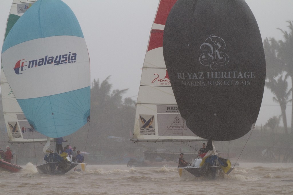 Jesper Radich leads Jeremy Koo in windy conditions on day 2 at the Monsoon Cup 2011. Kuala Terengannu, Malaysia. 24 November 2011. © Gareth Cooke/Subzero Images/ Monsoon Cup - copyright http://www.monsooncup.com.my