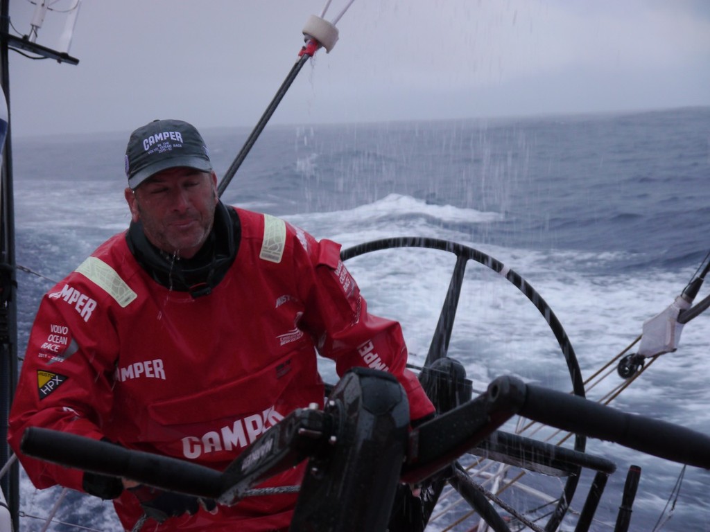 Rob Salthouse trimming in the rain onboard CAMPER with Emirates Team New Zealand during leg 1 of the Volvo Ocean Race 2011-12, from Alicante, Spain to Cape Town, South Africa. (Credit: Hamish Hooper/CAMPER ETNZ/Volvo Ocean Race) photo copyright Hamish Hooper/Camper ETNZ/Volvo Ocean Race taken at  and featuring the  class