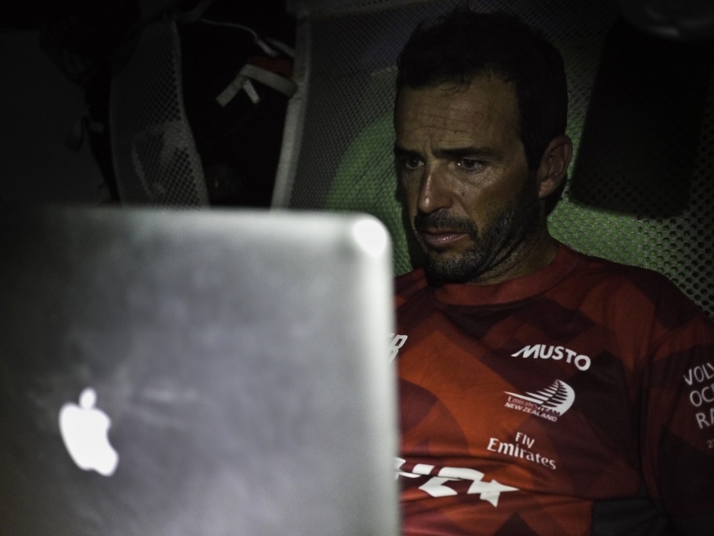 Roberto Bermudez Decastro does some writing in his offwatch onboard CAMPER with Emirates Team New Zealand during leg 1 of the Volvo Ocean Race 2011-12, from Alicante, Spain to Cape Town, South Africa. (Credit: Hamish Hooper/CAMPER ETNZ/Volvo Ocean Race) photo copyright Hamish Hooper/Camper ETNZ/Volvo Ocean Race taken at  and featuring the  class