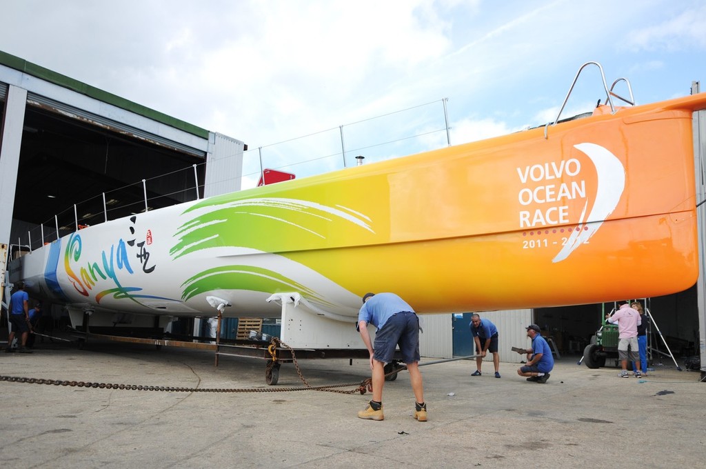 UK, Hamble. 5th August 2011. Team Sanya shore crew bring their Volvo Open 70 out of the boat shed at Hamble Yacht Servies. photo copyright Volvo Ocean Race http://www.volvooceanrace.com taken at  and featuring the  class