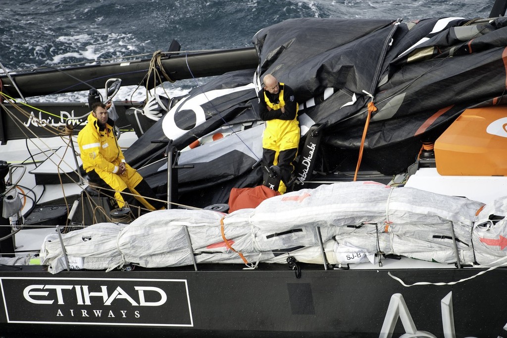 Abu Dhabi Ocean Racing's yacht Azzam, skippered by Britain's Ian Walker, returns to Alicante, Spain after the mast broke in rough weather on the first day of racing on leg 1 of the Volvo Ocean Race 2011-12. (Photo Credit must read: Paul Todd/Volvo Ocean Race) photo copyright Paul Todd/Volvo Ocean Race http://www.volvooceanrace.com taken at  and featuring the  class