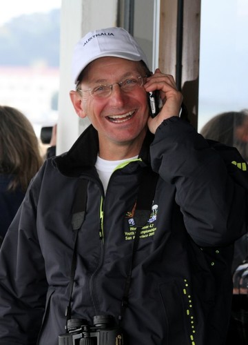 Anna’s excited father, Michael Vaughan, on the phone back to Hobart  - Laser 4.7 Championships 2011 © Richard Scarr