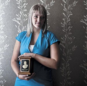 Mark Morley’s daughter, Sage Morley, holds an urn with some of her father’s ashes at her Wicker Park home.
 photo copyright Greg Ruffing taken at  and featuring the  class