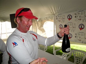 Mike Wolfs, boat captain shares the bubbly - Canada's Cup 2011 photo copyright Ed Kita taken at  and featuring the  class