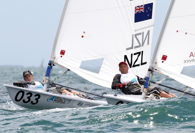 Andrew Murdoch (033) of New Zealand and Phillip Buhl of Germany compete on day 12 during the Laser - Men’s One Person Dinghy event of the 2011 ISAF Sailing World Championships © Paul Kane /Perth 2011 http://www.perth2011.com