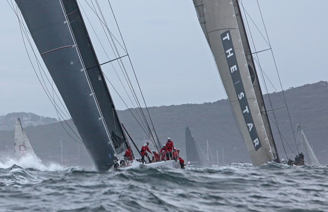 Wild Oats X1 leads Investec Loyal out of the harbour - Rolex Sydney Hobart 2011 © Crosbie Lorimer http://www.crosbielorimer.com