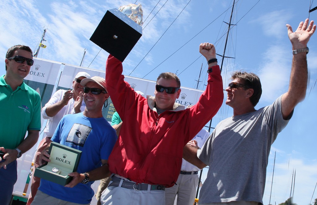 Loki crew with George Adams Trophy for overall handicap winnner. - Rolex Sydney Hobart Yacht Race 2011 photo copyright Crosbie Lorimer http://www.crosbielorimer.com taken at  and featuring the  class
