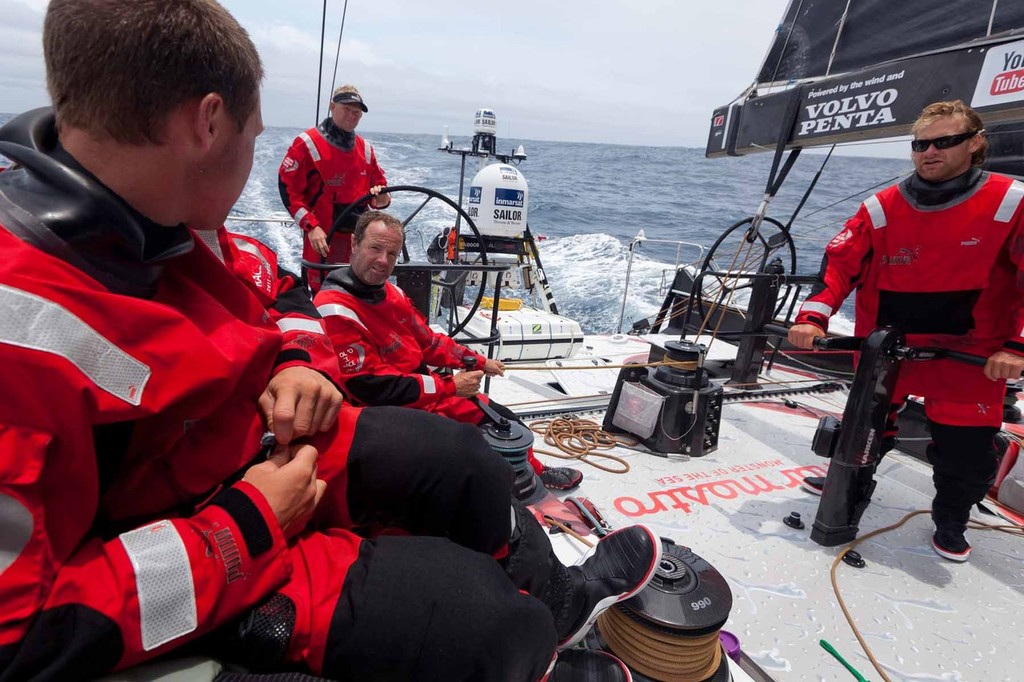 Mid-watch discussion between Rome Kirby (foreground), Michi Mueller (grinding), Tony Mutter (driving), and Jono Swain (sitting) during a calmer stretch of the day. PUMA Ocean Racing powered by BERG during leg 2 of the Volvo Ocean Race 2011-12, from Cape Town, South Africa to Abu Dhabi, UAE. (Credit: Amory Ross/PUMA Ocean Racing/Volvo Ocean Race) photo copyright Amory Ross/Puma Ocean Racing/Volvo Ocean Race http://www.puma.com/sailing taken at  and featuring the  class