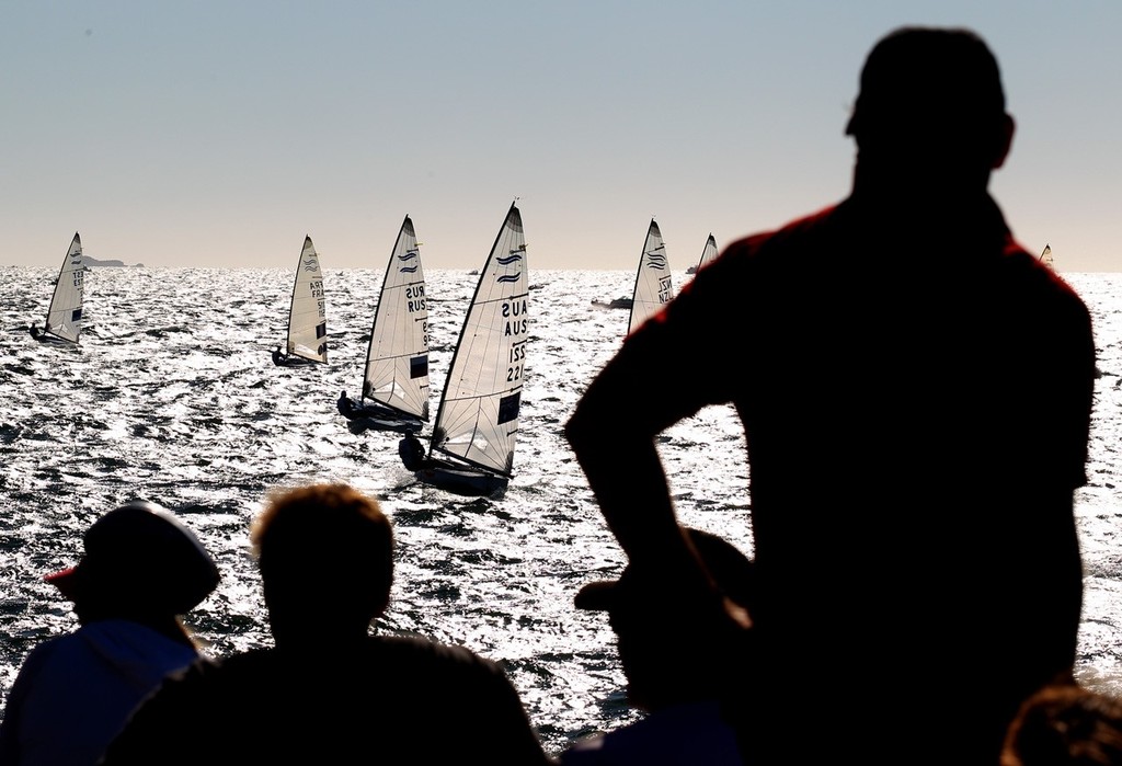 PERTH, AUSTRALIA - DECEMBER 10: Spectators watch the Finn Gold Fleet Race on day 8 during the Finn gold fleet race of the 2011 ISAF Sailing World Championships on December 10, 2011 in Perth, Australia. (Photo by Paul Kane/Perth 2011) photo copyright Paul Kane /Perth 2011 http://www.perth2011.com taken at  and featuring the  class