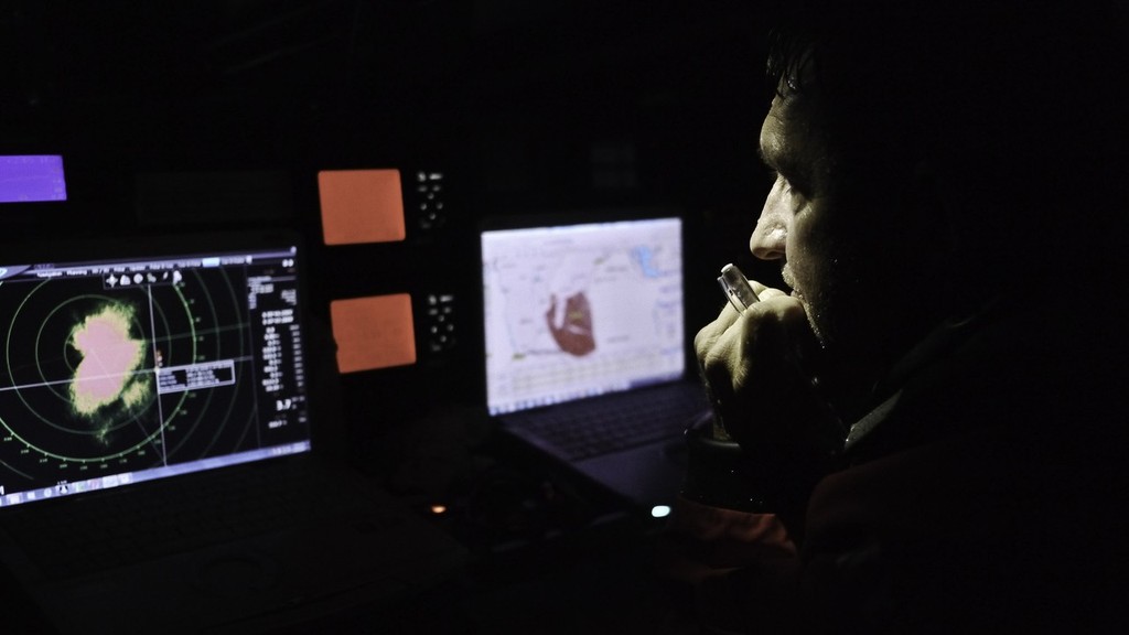 Navigator Will Oxley keeping an eye on the radar in the Nav station onboard CAMPER with Emirates Team New Zealand during leg 2 of the Volvo Ocean Race 2011-12, from Cape Town, South Africa to Abu Dhabi, UAE. (Credit: Hamish Hooper/CAMPER ETNZ/Volvo Ocean Race) photo copyright Hamish Hooper/Camper ETNZ/Volvo Ocean Race taken at  and featuring the  class
