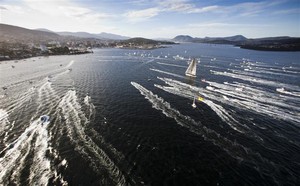 INVESTEC LOYAL escorted by spectator craft before crossing the finish line - Rolex Sydney Hobart Yacht Race 2011 photo copyright  Rolex/Daniel Forster http://www.regattanews.com taken at  and featuring the  class