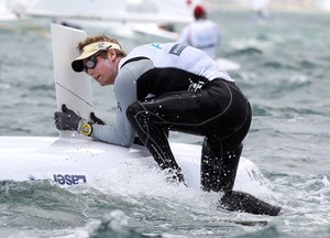 PERTH, AUSTRALIA - DECEMBER 14: Mathias Mollatt of Norway attempts to re-right his boat on day 12 during the Laser - Men's One Person Dinghy event of the 2011 ISAF Sailing World Championships on December 14, 2011 in Perth, Australia. (Photo by Paul Kane/Perth 2011) photo copyright Paul Kane /Perth 2011 http://www.perth2011.com taken at  and featuring the  class