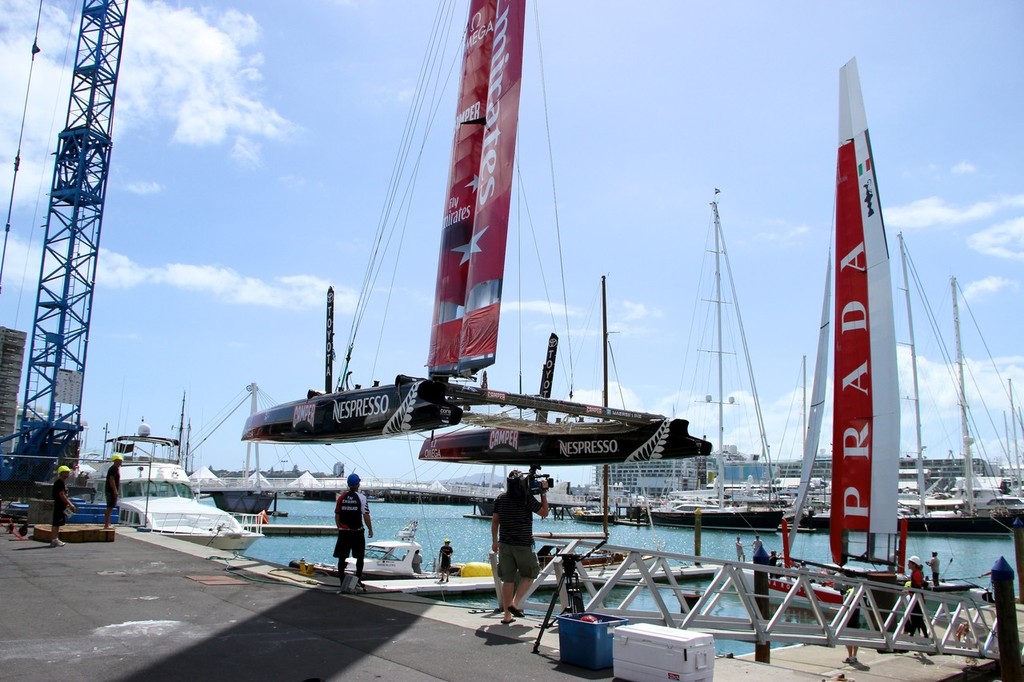 Emirates Team NZ’s AC45 is craned into the water with Luna Rossa at Auckland’s Viaduct harbour © Richard Gladwell www.photosport.co.nz