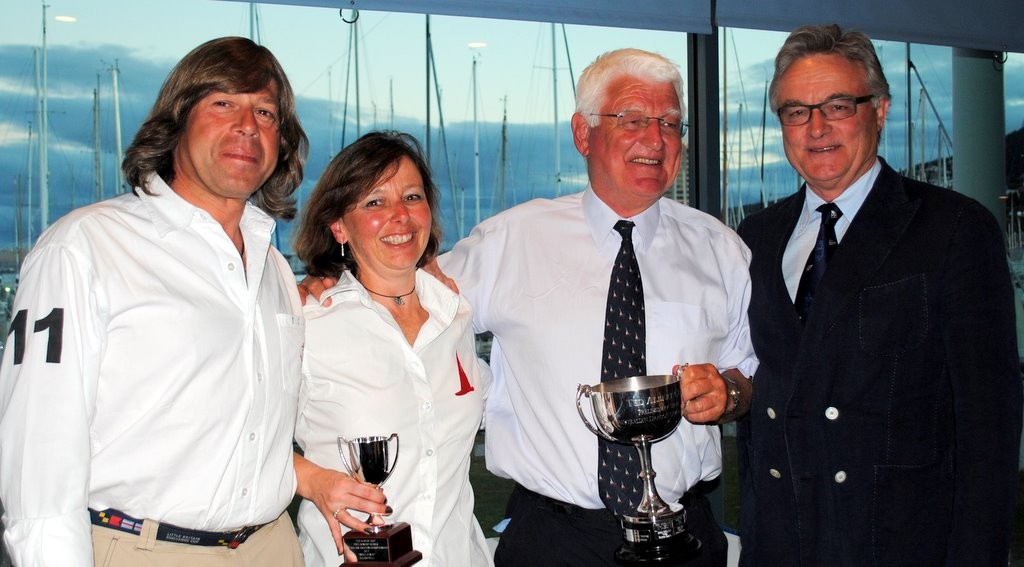 Newly elected Australian president of the International Dragon Association, Wolf Breit (right) presents the Ted Albert Memorial Trophy to Robert Campbell (second from right), outgoing World president of the IDA,  and his crew, Rene Nel and Simon Cash - Internatio?nal Dragon class regatta in Hobart photo copyright  Andrea Francolini Photography http://www.afrancolini.com/ taken at  and featuring the  class