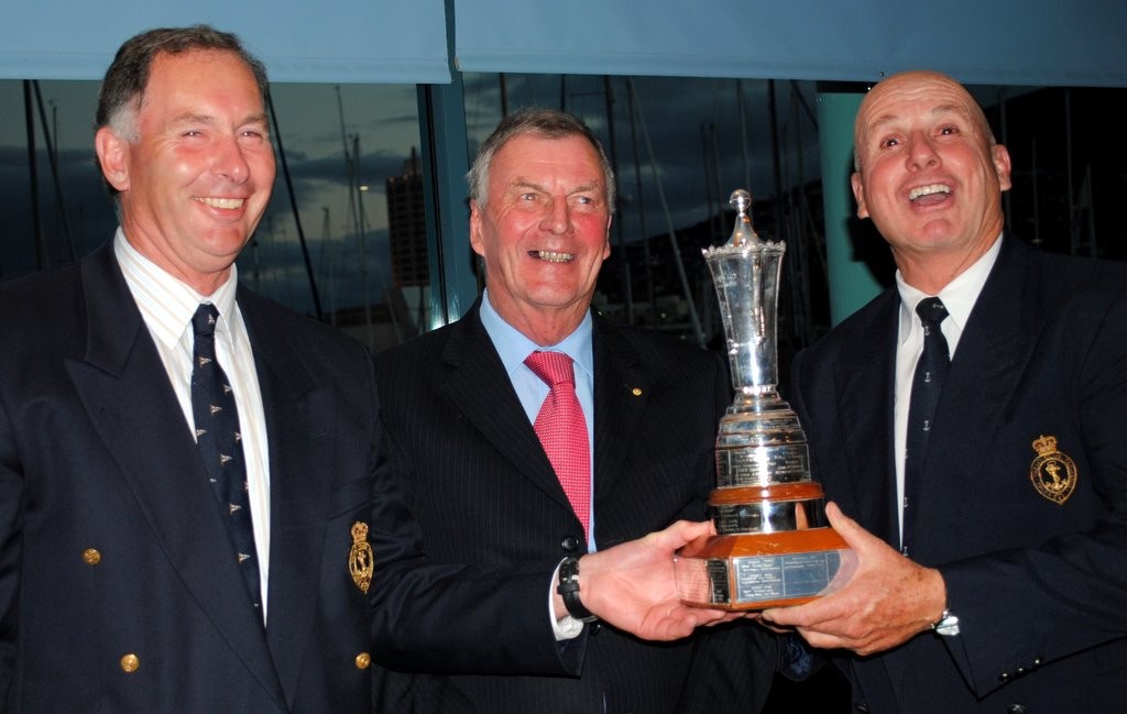The Governor of Tasmania Mr Peter Underwood AC presents the Prince Philip Cup the crew of Karabos IX, Nick skipper Nick Rogers (right) and mainsheet trimmer Leigh Behrens (left). Bowman Simon Burrows was not able to be present - Internatio?nal Dragon class regatta in Hobart photo copyright  Andrea Francolini Photography http://www.afrancolini.com/ taken at  and featuring the  class