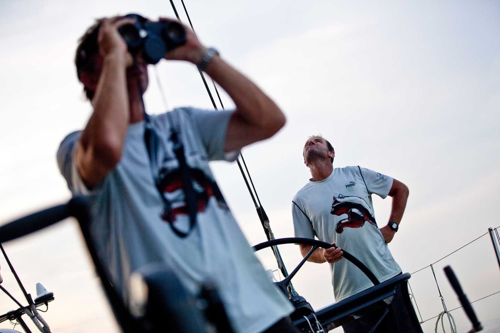 Jono Swain looking at the sails while Ken Read looks through the binoculars for wind on the horizon. PUMA Ocean Racing powered by BERG during leg 3 of the Volvo Ocean Race 2011-12, from Abu Dhabi, UAE to Sanya, China. (Credit: Amory Ross/PUMA Ocean Racing/Volvo Ocean Race) photo copyright Amory Ross/Puma Ocean Racing/Volvo Ocean Race http://www.puma.com/sailing taken at  and featuring the  class
