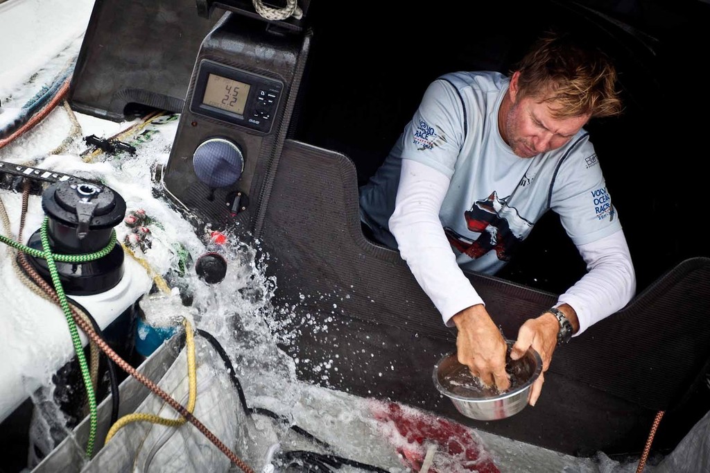 Ken Read at the dishwasher. PUMA Ocean Racing powered by BERG during leg 4 of the Volvo Ocean Race 2011-12, from Sanya, China to Auckland, New Zealand. (Credit: Amory Ross/PUMA Ocean Racing/Volvo Ocean Race) photo copyright Amory Ross/Puma Ocean Racing/Volvo Ocean Race http://www.puma.com/sailing taken at  and featuring the  class