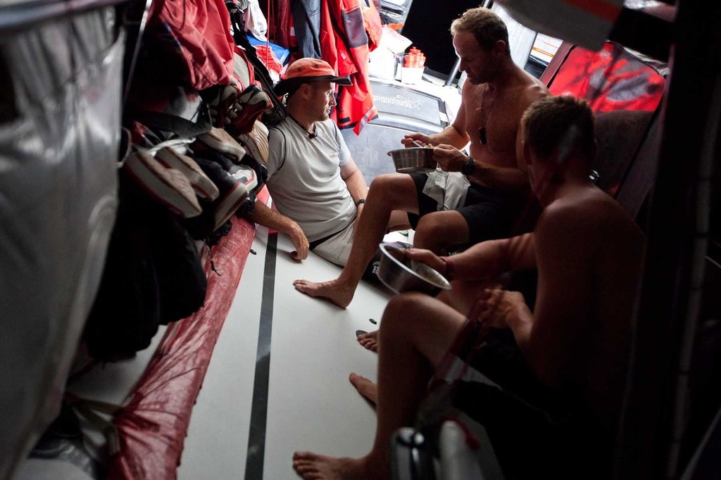 Lunchtime onboard the ``Mar Mostro.`` PUMA Ocean Racing powered by BERG during leg 3 of the Volvo Ocean Race 2011-12, from Abu Dhabi, UAE to Sanya, China. (Credit: Amory Ross/PUMA Ocean Racing/Volvo Ocean Race) photo copyright Amory Ross/Puma Ocean Racing/Volvo Ocean Race http://www.puma.com/sailing taken at  and featuring the  class