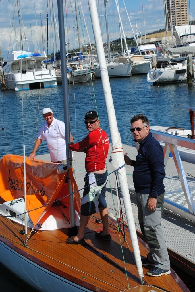 Outgoing president of the Australian Dragon Assocaition, Andrew Merrett, and his crew of Amazing Grace, Chris Kell and Charles Stanton, tidy up their boat after race one - Prince Philip Cup Regatta 2012 photo copyright Rob Cruse taken at  and featuring the  class