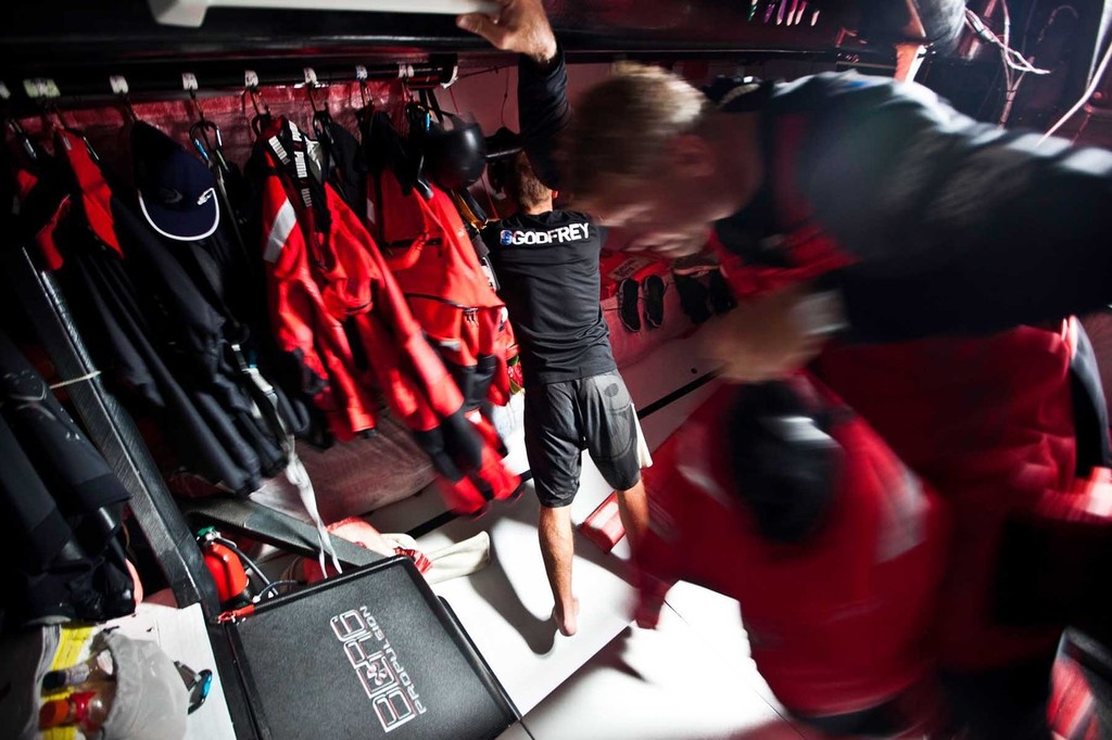 Tony Mutter and Ryan Godfrey getting ready for wet times on deck. PUMA Ocean Racing powered by BERG during leg 3 of the Volvo Ocean Race 2011-12, from Abu Dhabi, UAE to Sanya, China. (Credit: Amory Ross/PUMA Ocean Racing/Volvo Ocean Race) photo copyright Amory Ross/Puma Ocean Racing/Volvo Ocean Race http://www.puma.com/sailing taken at  and featuring the  class