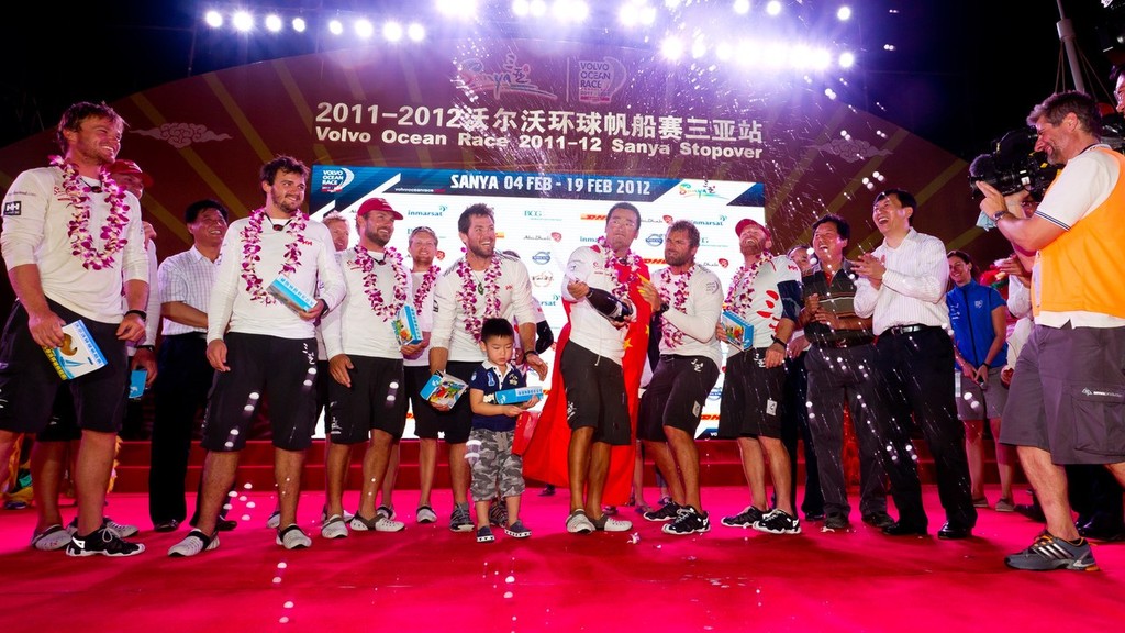 Teng Jiang He sprays champagne on stage, after Team Sanya, skippered by Mike Sanderson from New Zealand finish sixth on leg 3 of the Volvo Ocean Race 2011-12 from Abu Dhabi, UAE, to Sanya, China. (Credit: IAN ROMAN/Volvo Ocean Race) photo copyright Ian Roman/Volvo Ocean Race http://www.volvooceanrace.com taken at  and featuring the  class