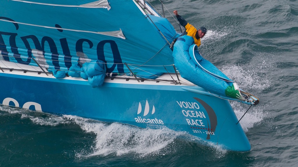 Bowman Zane Gills trying to control the jennaker onboard Team Telefonica, skippered by Iker Martinez from Spain, in the Sanya Haitang Bay In-Port Race, during the Volvo Ocean Race 2011-12. (Credit: IAN ROMAN/Volvo Ocean Race) photo copyright Ian Roman/Volvo Ocean Race http://www.volvooceanrace.com taken at  and featuring the  class