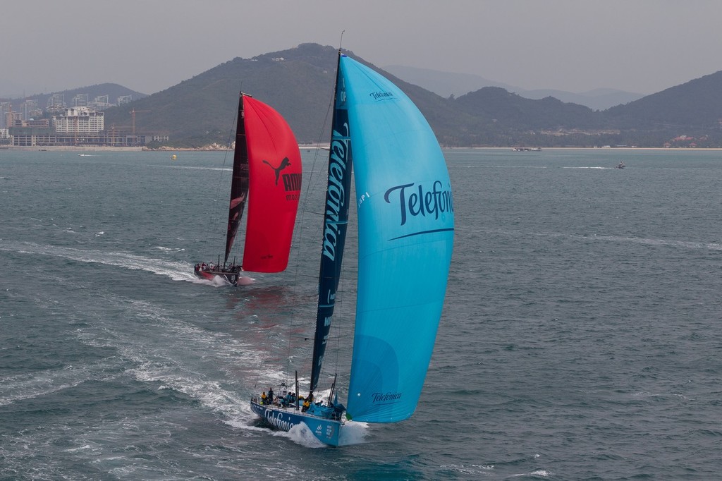 PUMA Ocean Racing powered by BERG, skippered by Ken Read from the USA chasing Team Telefonica, skippered by Iker Martinez from Spain, in the Sanya Haitang Bay In-Port Race, during the Volvo Ocean Race 2011-12. (Credit: IAN ROMAN/Volvo Ocean Race) photo copyright Ian Roman/Volvo Ocean Race http://www.volvooceanrace.com taken at  and featuring the  class