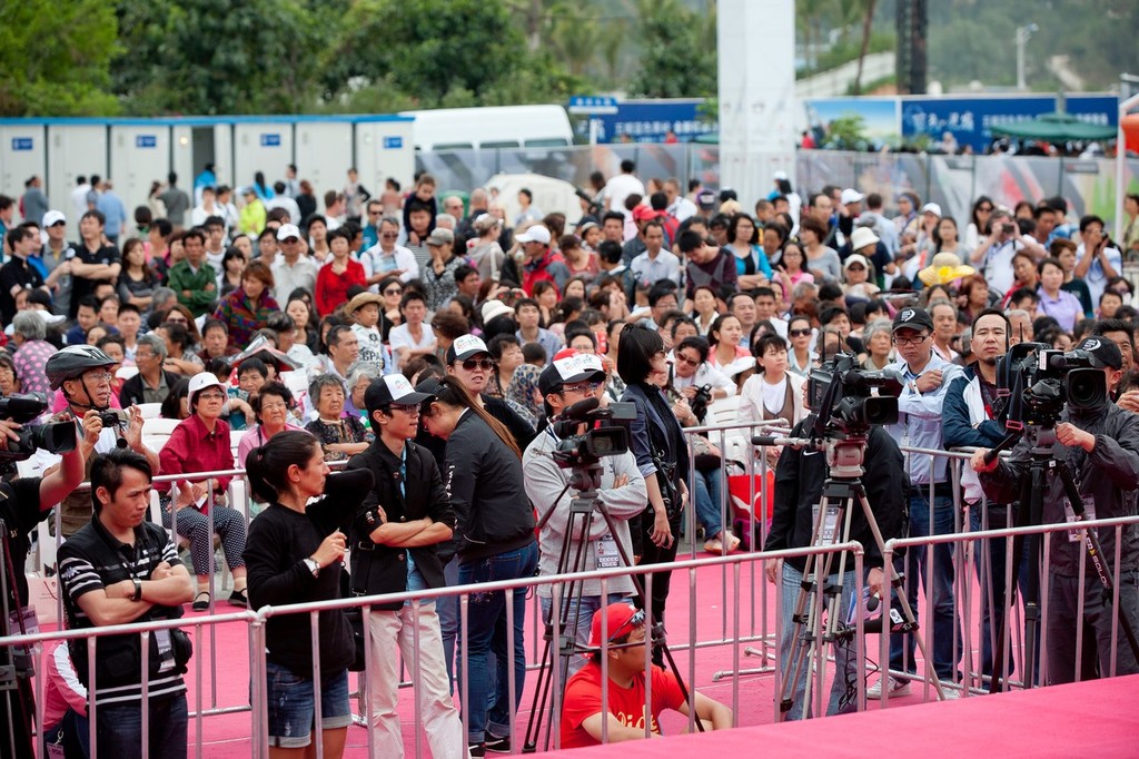 The crowd and press waiting for the winners of Sanya Haitang Bay In-Port Race, during the Volvo Ocean Race 2011-12. <br />
 © Paul Todd/Volvo Ocean Race http://www.volvooceanrace.com