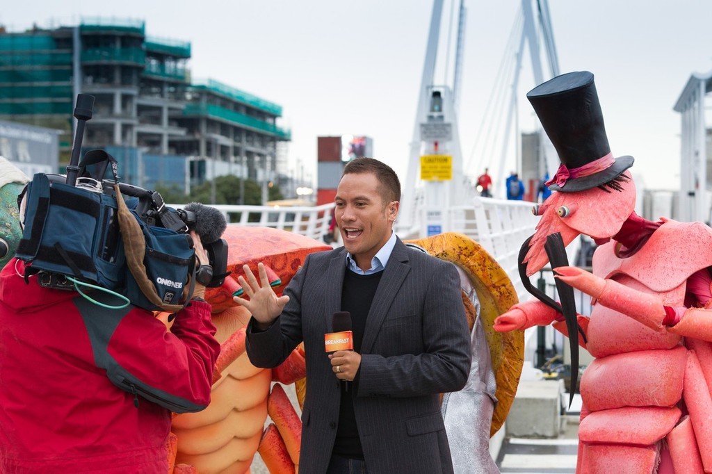 TVNZ Breakfast Show weather man Tamati Coffey broadcasts live from the official opening of the Auckland race village, for the Volvo Ocean Race 2011-12. (Credit: IAN ROMAN/Volvo Ocean Race) photo copyright Paul Todd/Volvo Ocean Race http://www.volvooceanrace.com taken at  and featuring the  class