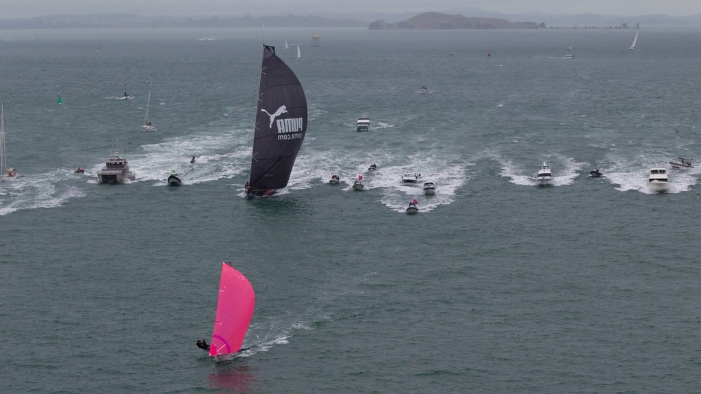 PUMA Ocean Racing powered by BERG, skippered by Ken Read from the USA is followed by spectator boats as they take second place on leg 4 in Auckland, during the Volvo Ocean Race 2011-12.  © Ian Roman/Volvo Ocean Race http://www.volvooceanrace.com