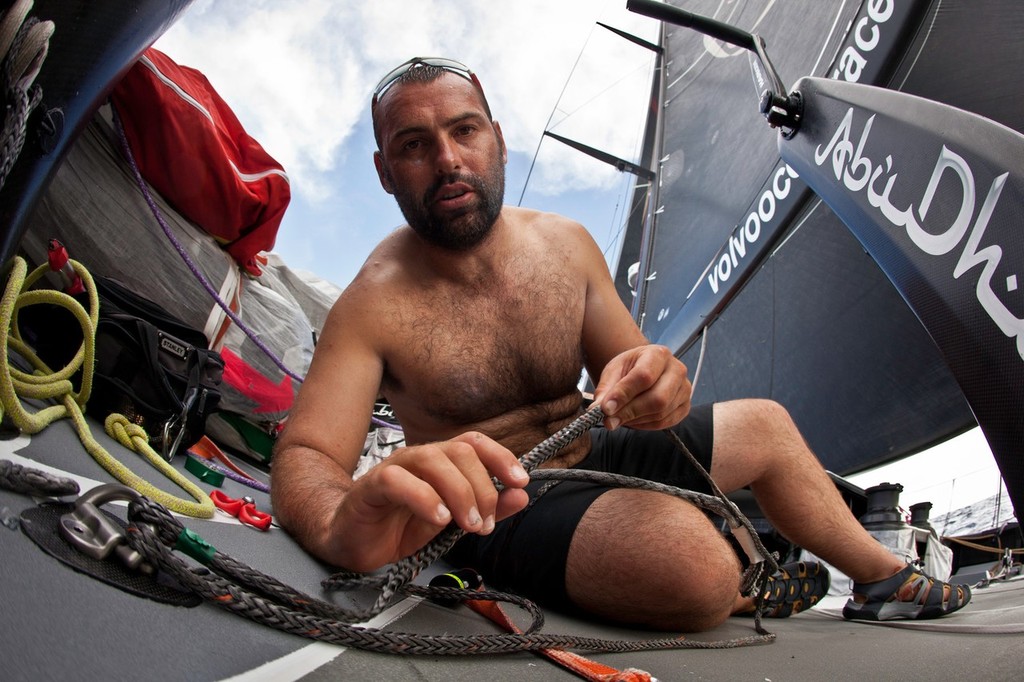 Wade Morgan splices a new jib ’up/down’ line onboard Abu Dhabi Ocean Racing during leg 4 of the Volvo Ocean Race 2011-12, from Sanya, China to Auckland, New Zealand. © Nick Dana/Abu Dhabi Ocean Racing /Volvo Ocean Race http://www.volvooceanrace.org