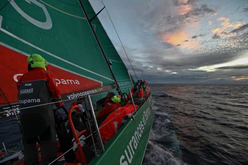 Phil Harmer driving as the sun set onboard Groupama Sailing Team during leg 4 of the Volvo Ocean Race 2011-12, from Sanya, China to Auckland, New Zealand. (Credit: Yann Riou/Groupama Sailing Team/Volvo Ocean Race) photo copyright Yann Riou/Groupama Sailing Team /Volvo Ocean Race http://www.cammas-groupama.com/ taken at  and featuring the  class
