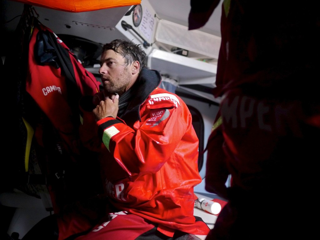 Daryl Wislang getting undressed having come off watch onboard CAMPER with Emirates Team New Zealand during leg 4 of the Volvo Ocean Race 2011-12, from Sanya, China to Auckland, New Zealand. (Credit: Hamish Hooper/CAMPER ETNZ/Volvo Ocean Race) photo copyright Hamish Hooper/Camper ETNZ/Volvo Ocean Race taken at  and featuring the  class