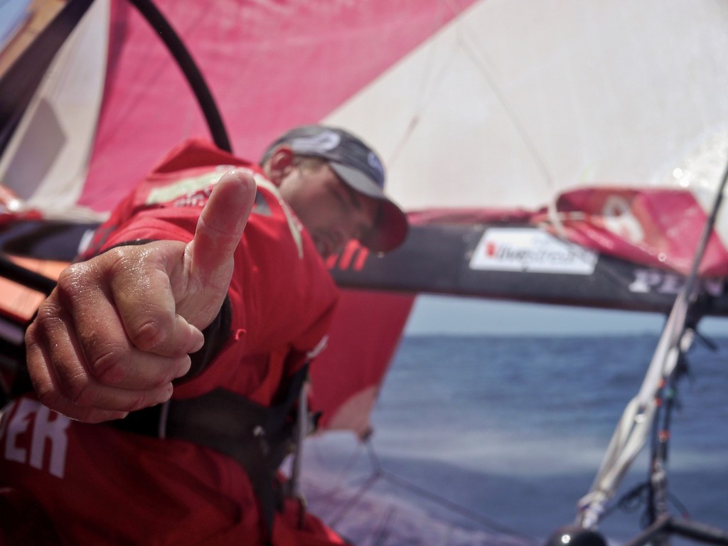 Thumbs up from Mike Pammenter to a good sked report onboard CAMPER with Emirates Team New Zealand during leg 4 of the Volvo Ocean Race 2011-12, from Sanya, China to Auckland, New Zealand. (Credit: Hamish Hooper/CAMPER ETNZ/Volvo Ocean Race) photo copyright Hamish Hooper/Camper ETNZ/Volvo Ocean Race taken at  and featuring the  class