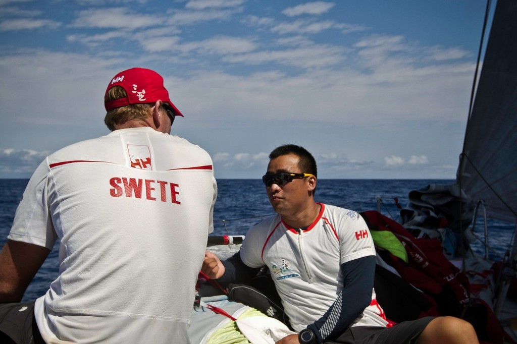 David Swete and Teng Jiang He having a chat onboard Team Sanya during leg 4 of the Volvo Ocean Race 2011-12, from Sanya, China to Auckland, New Zealand.  © Andres Soriano/Team Sanya/Volvo Ocean Race