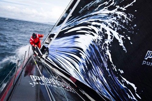 Michi Mueller goes to the bow for a jib change with New Zealand’s Cape Reinga in the background. © Amory Ross/Puma Ocean Racing/Volvo Ocean Race http://www.puma.com/sailing