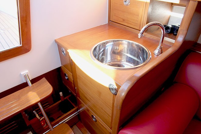 Galley has a small stove and the all-important wine bottle storage. - Ringle 39 ©  John Curnow