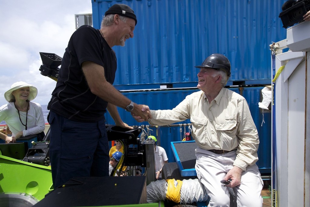 Filmmaker and National Geographic Explorer-in-Residence James Cameron is congratulated by ocean explorer and U.S. Navy Capt. Don Walsh, right, after completing the first ever solo dive 35, 756 feet down to the “Challenger Deep,” the lowest part of the Mariana Trench. Walsh took the same journey to the bottom of the Mariana Trench 52 years ago in the bathyscaphe Trieste, with Swiss oceanographer Jacques Piccard. Cameron’s dive in his specially designed submersible was part of DEEPSEA CHALLENGE, a © Mark Thiessen National Geographic