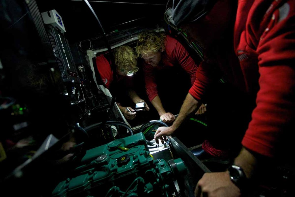 Casey Smith, Michi Mueller, and Tom Addis get to work trying to fix one of the sheared engine mounts, a breakage believed to have occurred in the heavy upwind conditions leaving Auckland. PUMA Ocean Racing powered by BERG during leg 5 of the Volvo Ocean Race 2011-12, from Auckland, New Zealand, to Itajai, Brazil. (Credit: Amory Ross/PUMA Ocean Racing/Volvo Ocean Race) photo copyright Amory Ross/Puma Ocean Racing/Volvo Ocean Race http://www.puma.com/sailing taken at  and featuring the  class