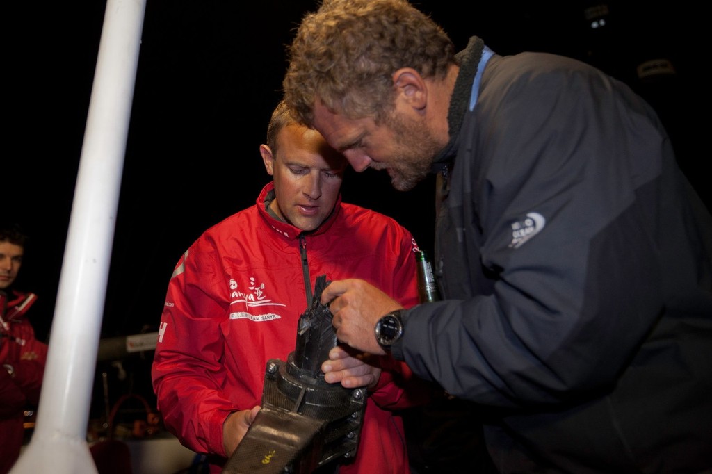 Richard Mason explains how the damage occurred the the broken rudder stock. Team Sanya skippered by Mike Sanderson from New Zealand, arrive in Tauranga, New Zealand, after a broken rudder and hull damage forced them to sail back, during leg 5 of the Volvo Ocean Race 2011-12, from Auckland, New Zealand to Itajai, Brazil. They are now forced to retire from leg five and miss leg six of the race and ship their race boat and equipment to Miami. (Credit: Gareth Cooke/Volvo Ocean Race) photo copyright Gareth Cooke/Volvo Ocean Race http://www.volvooceanrace.com taken at  and featuring the  class