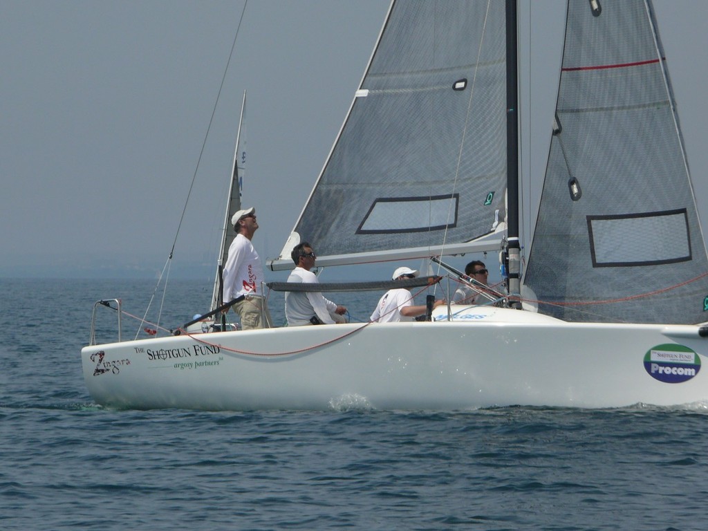 Trimming the sails on a Melges 24 - Toronto & Area Hospice Regatta (TAHR) photo copyright Dave McGuire taken at  and featuring the  class