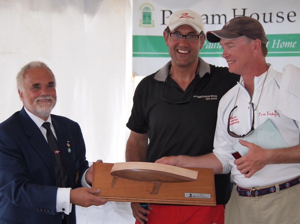 National Yacht Club Commodore Henry Piersig and Race Chair Richard Reid presenting the trophy for the winning Beneteau 36.7 to Gary Tisdale on the yacht : First Today - 2012 Toronto Hospice Regatta © Dave McGuire