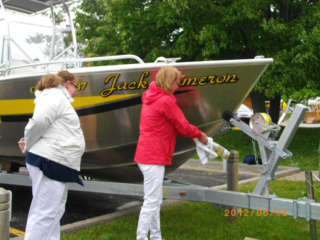 Michelle (daughter) and Melissa (granddaughter) Cameron take a few tries to crack the bubbly - Christening of ABYC mark/pin boat named to honour Jack Cameron photo copyright Katie Nicoll taken at  and featuring the  class