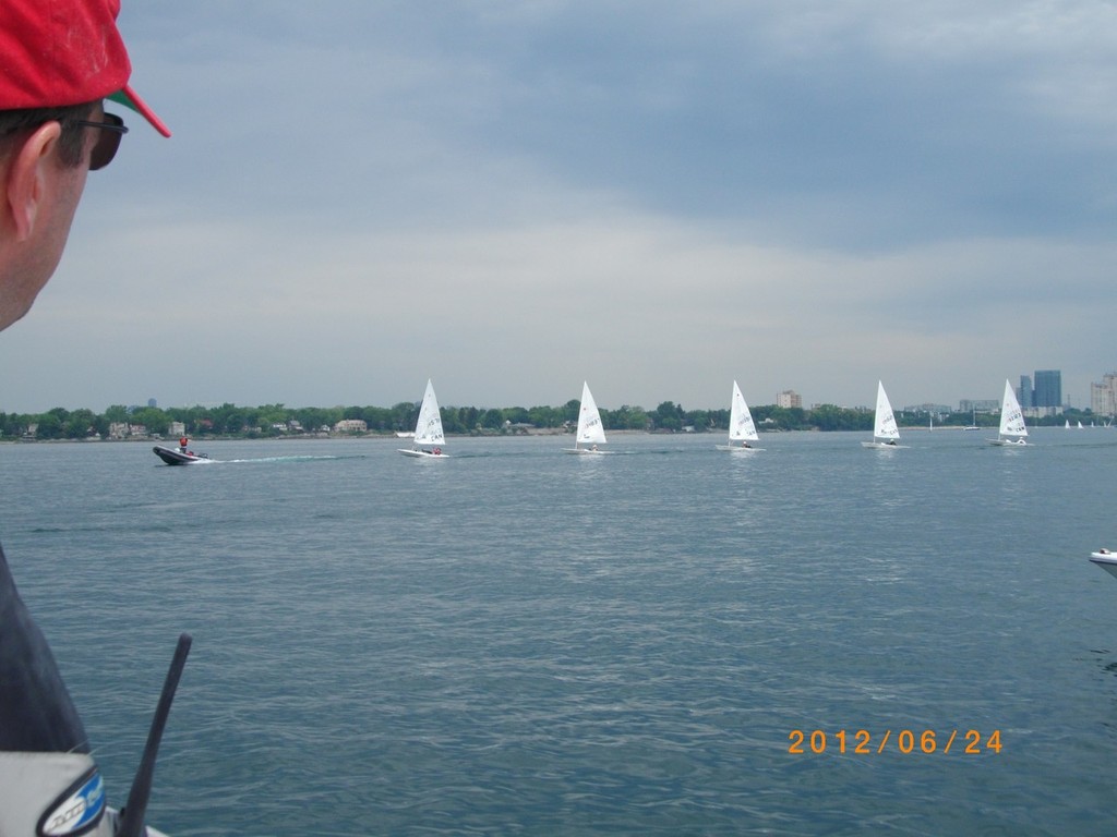 A fast way out to the race course when there is no wind - 2012 Laser and Radial Canadian Championships at Etobicoke Yacht Club photo copyright Katie Nicoll taken at  and featuring the  class