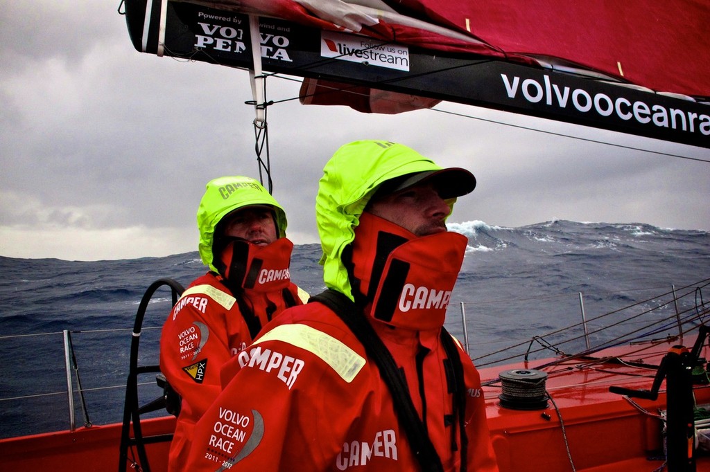 Tony Rae and Adam Minoprio wrapped up warm on deck of CAMPER with Emirates Team New Zealand during leg 5 of the Volvo Ocean Race 2011-12, from Auckland, New Zealand to Itajai, Brazil. (Credit: Hamish Hooper/CAMPER ETNZ/Volvo Ocean Race) photo copyright Hamish Hooper/Camper ETNZ/Volvo Ocean Race taken at  and featuring the  class