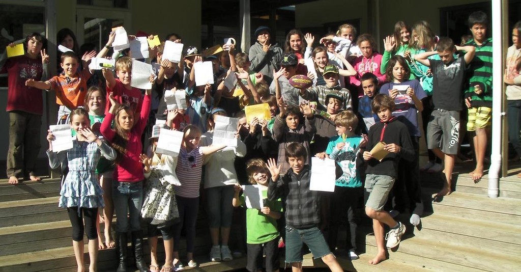 OceansWatch - Ngunguru pupils showing the letters they received from Karkar Island photo copyright  SW taken at  and featuring the  class